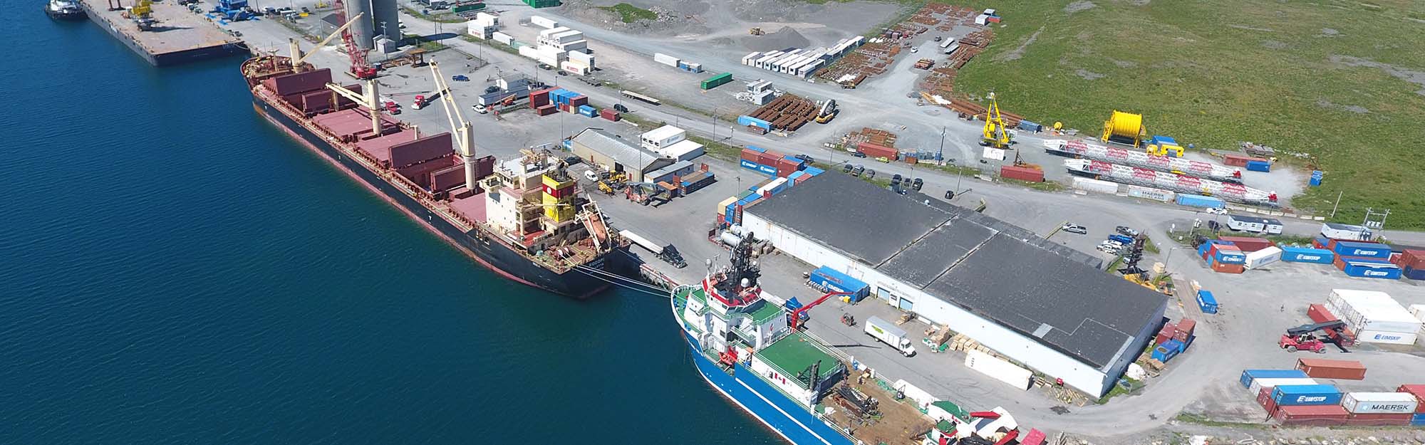 Aerial view of Port of Argentia docks, with 2 large ships